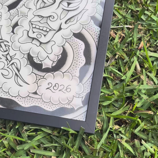 Video showing two black-framed black and grey tattoo flash sheets by Indi Giblin.